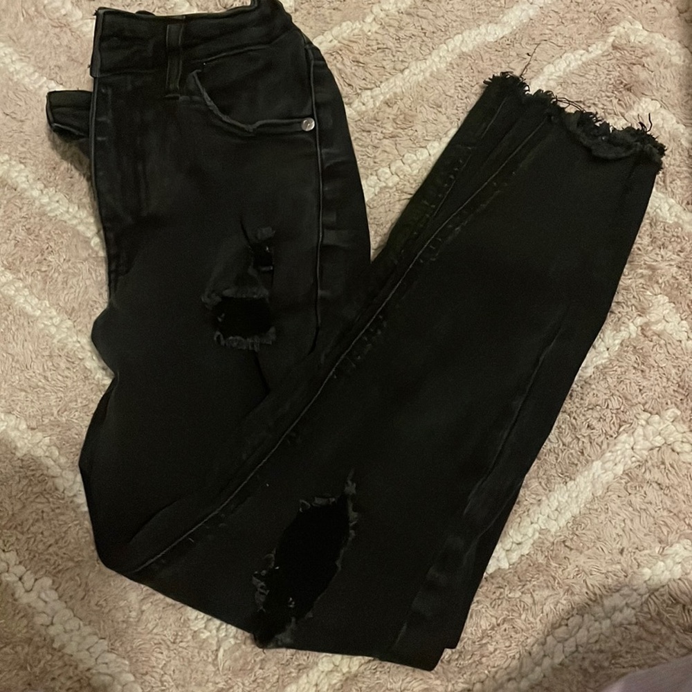 Black art class ripped jeans